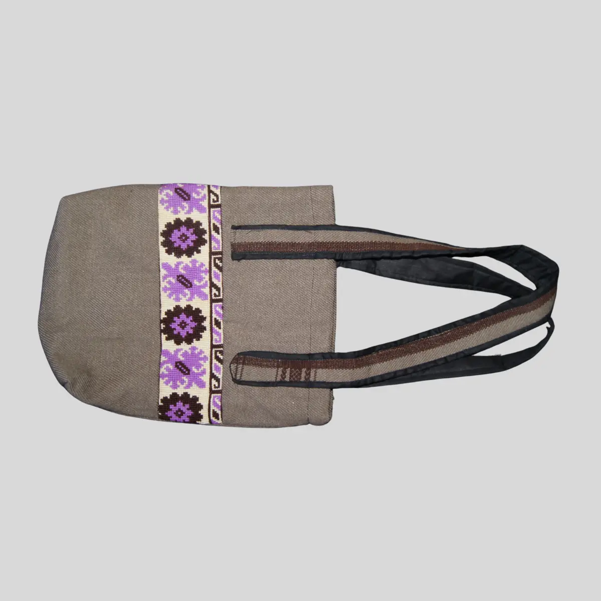 Natural canvas tote bag with purple and black geometric cross-stitch trim panel