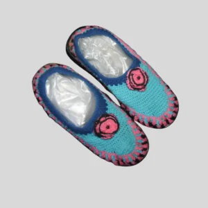 Turquoise blue crochet house shoes with pink flower accent and non-slip soles