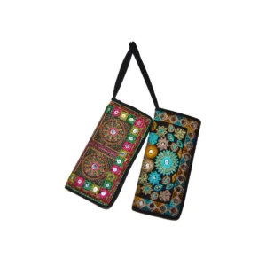 Two coordinated embroidered wallets with complementary geometric patterns and mirror work