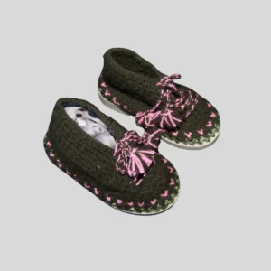 Grey knit house shoes with pink decorative laces and rubber outdoor soles