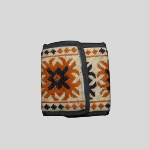 Bright orange coin purse with traditional kilim geometric pattern in navy and cream