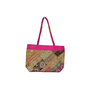 Pink tote bag with beads, sequins, and gold embroidery creating layered sparkle