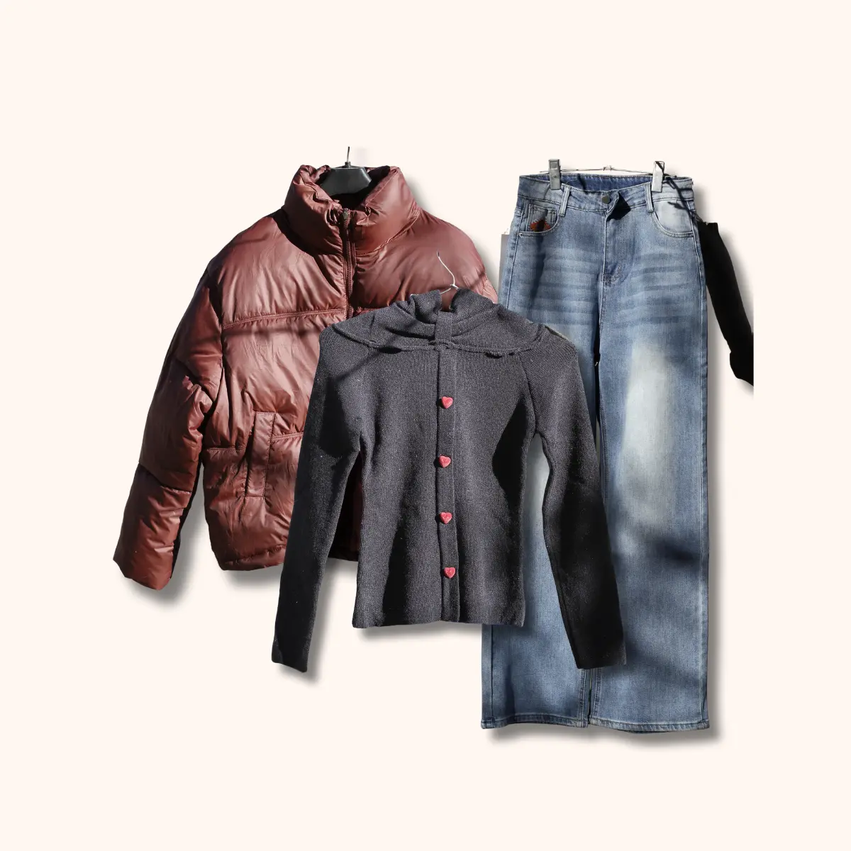 Three piece winter outfit set with mauve pink puffer jacket grey heart button cardigan light wash denim jeans